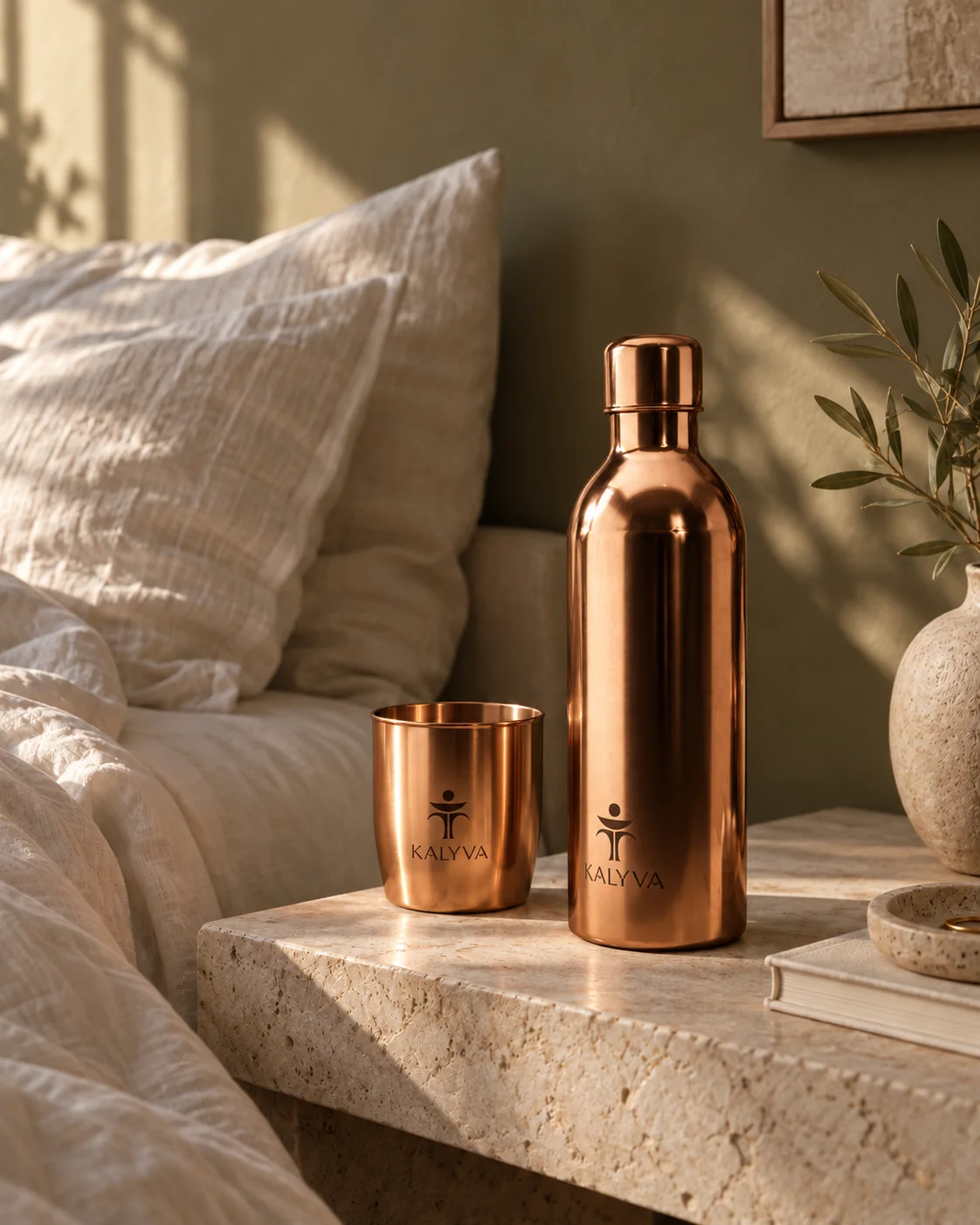 Copper bottle and tumbler on a bedside table